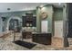 Granite counters complement the kitchen's center island and cooktop range at 5269 Karlsburg Pl, Palm Harbor, FL 34685