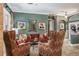 Inviting living room featuring comfortable seating, stylish decor, and ample natural light at 5269 Karlsburg Pl, Palm Harbor, FL 34685