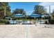 Recreation area featuring covered picnic tables and sports courts for outdoor enjoyment at 5269 Karlsburg Pl, Palm Harbor, FL 34685