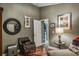 Another angle of the sitting room with decor, wood floors, and warm, stylish decor at 5269 Karlsburg Pl, Palm Harbor, FL 34685