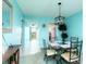 Cozy dining room with a glass table and black metal chairs at 5575 Gulf Blvd # 421, St Pete Beach, FL 33706