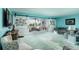 Spacious living room with sliding barn doors and coastal decor, offering a relaxing atmosphere at 5575 Gulf Blvd # 421, St Pete Beach, FL 33706