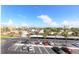 Spacious parking lot surrounded by palm trees and lush greenery, offering convenient parking for residents at 5575 Gulf Blvd # 421, St Pete Beach, FL 33706
