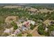 Aerial view of the home in a neighborhood with mature trees, pool and well-maintained landscaping at 5807 Thoreau Pl, Lithia, FL 33547