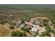 Aerial view of the home in a wooded neighborhood with mature trees and well-maintained landscaping at 5807 Thoreau Pl, Lithia, FL 33547