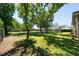 Expansive backyard with mature trees and lush green grass at 5807 Thoreau Pl, Lithia, FL 33547