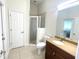 Bright bathroom featuring a walk-in shower and modern fixtures at 5807 Thoreau Pl, Lithia, FL 33547