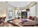 Bedroom featuring a comfortable chaise lounge, wood floors, and natural lighting at 5807 Thoreau Pl, Lithia, FL 33547