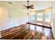 Bright bonus room with hardwood floors and views of the screened pool at 5807 Thoreau Pl, Lithia, FL 33547