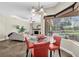 The dining room features natural lighting with a view of the pool and backyard at 5807 Thoreau Pl, Lithia, FL 33547
