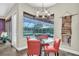 The dining room features natural lighting with a view of the pool and backyard at 5807 Thoreau Pl, Lithia, FL 33547
