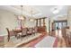 Elegant dining room featuring modern lighting, stylish decor, and a large window to let in natural light at 5807 Thoreau Pl, Lithia, FL 33547