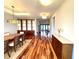 Bright dining room featuring sleek hardwood floors and modern shelving at 5807 Thoreau Pl, Lithia, FL 33547