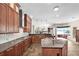 Spacious kitchen with a large island, stone countertops, and stainless steel appliances at 5807 Thoreau Pl, Lithia, FL 33547