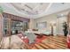Inviting living room with hardwood floors and a wall of windows offering stunning outdoor views at 5807 Thoreau Pl, Lithia, FL 33547