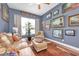 Inviting living room features natural light, cozy seating, and beautiful decor at 5807 Thoreau Pl, Lithia, FL 33547