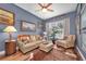 Bright living room with comfortable seating, stylish accents, and a ceiling fan at 5807 Thoreau Pl, Lithia, FL 33547