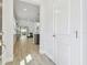 Bright entryway with tile floors leading to an open living space and a view of the sliding glass doors at 5833 Grand Sonata Ave, Lutz, FL 33558