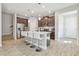 Modern kitchen featuring stainless steel appliances, a kitchen island, and barstool seating at 5833 Grand Sonata Ave, Lutz, FL 33558