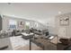 Open concept living space with a comfortable seating area and modern office space at 5833 Grand Sonata Ave, Lutz, FL 33558