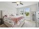 Inviting main bedroom with plush carpet, large window, and decorative accents at 5833 Grand Sonata Ave, Lutz, FL 33558