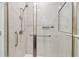 Contemporary shower with glass door and tiled surround at 5833 Grand Sonata Ave, Lutz, FL 33558