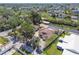 Aerial view of a house on the water, showcasing a swimming pool, and boat lift at 6732 Udell Ln, Hudson, FL 34667