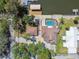 Overhead image showing a waterfront property with a pool, boat lift, and dock at 6732 Udell Ln, Hudson, FL 34667