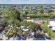 Stunning aerial view of a waterfront home with lush greenery and a private dock along a canal at 6732 Udell Ln, Hudson, FL 34667
