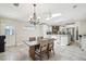 Open-concept dining room with view of the kitchen and its modern appliances at 6732 Udell Ln, Hudson, FL 34667