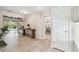 Welcoming foyer with decorative wood accents, tile flooring, and access to the dining area at 6732 Udell Ln, Hudson, FL 34667