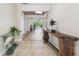 Inviting entryway boasts tile floors, complemented by wood accents and views of the pool at 6732 Udell Ln, Hudson, FL 34667
