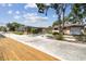 Single-Gathering home with a screened-in patio, a well-manicured yard, and access to the water with dock at 6732 Udell Ln, Hudson, FL 34667
