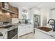 Modern kitchen featuring granite countertops, stainless appliances, and ample cabinet space at 6732 Udell Ln, Hudson, FL 34667