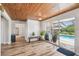 Bright living room with sliding doors leading to a pool area at 6732 Udell Ln, Hudson, FL 34667