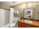 Bathroom featuring a tub/shower combination, a vanity, and mirror at 7157 Quail Hollow Blvd, Wesley Chapel, FL 33544