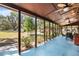 Covered porch overlooking spacious yard, ideal for outdoor living and entertaining at 7157 Quail Hollow Blvd, Wesley Chapel, FL 33544