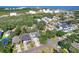 An aerial view shows the roof, landscaping and proximity to other houses in the neighborhood at 7501 S Morton St, Tampa, FL 33616