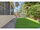 The backyard has artificial turf, a hammock, a storage shed, and an outdoor seating area at 7501 S Morton St, Tampa, FL 33616