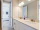 Stylish bathroom featuring a double vanity with a quartz countertop and modern lighting at 7501 S Morton St, Tampa, FL 33616