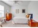 Well-lit bedroom with a ceiling fan, decor, and a window for natural light at 7501 S Morton St, Tampa, FL 33616
