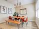 Charming dining room with a natural wood table, bench, modern lighting, and stylish decor at 7501 S Morton St, Tampa, FL 33616