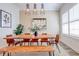 Bright dining room featuring a live-edge table with seating and modern pendant lighting at 7501 S Morton St, Tampa, FL 33616
