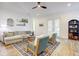 Elegant living room showcasing a cozy sofa, decorative elements, and ample light at 7501 S Morton St, Tampa, FL 33616