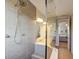 Shower boasts modern tile design with a rainfall showerhead and a glass door at 7501 S Morton St, Tampa, FL 33616