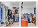 Organized walk-in closet with shelves and hanging rods for clothing and accessories storage at 7501 S Morton St, Tampa, FL 33616