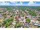 Aerial view featuring a home with tree coverage in a well-maintained residential neighborhood at 7703 W Hiawatha St, Tampa, FL 33615