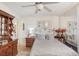 Cozy bedroom with white walls, mirrored wall and warm wood accents at 7703 W Hiawatha St, Tampa, FL 33615