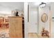 Hallway featuring hardwood floors and views of the dining room at 7703 W Hiawatha St, Tampa, FL 33615