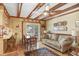Bright living room boasts wood beam ceiling and access to outdoor patio at 7703 W Hiawatha St, Tampa, FL 33615